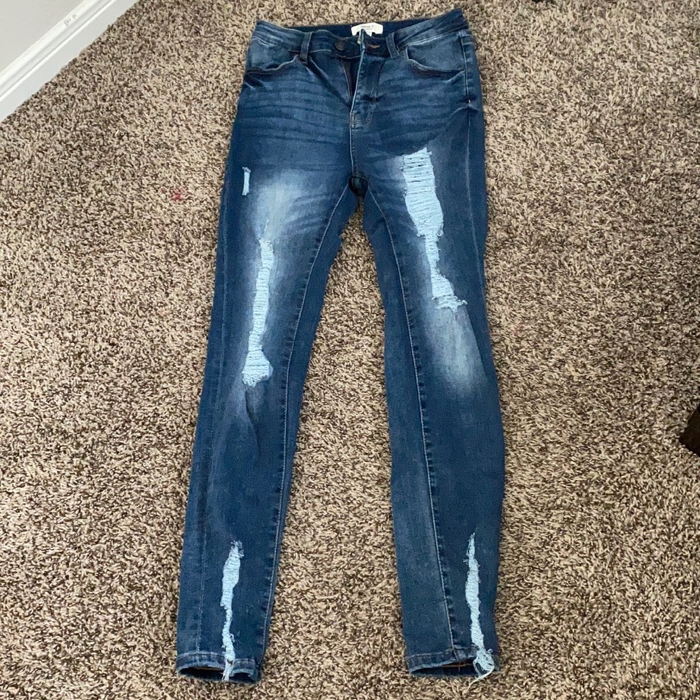 Distressed blue jeans
